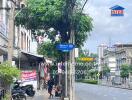 Street view of a commercial area with a mix of buildings and shops.