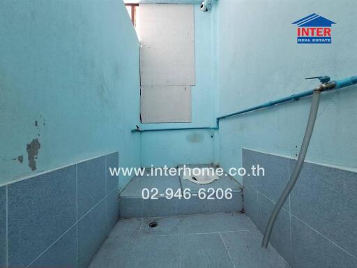 Basic tiled bathroom with blue walls