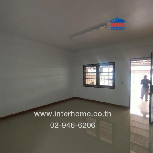 empty bedroom with window and door