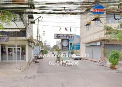 Street view with buildings and business sign