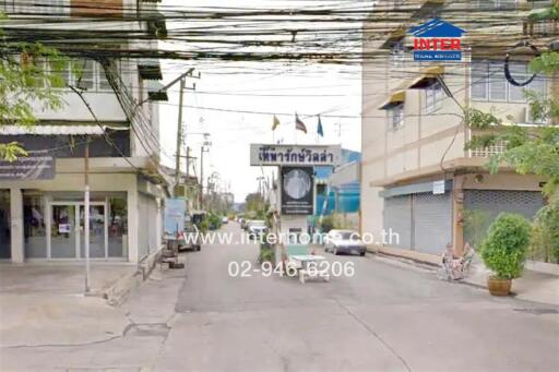 Street view with buildings and business sign