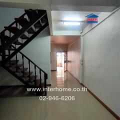 Interior hallway with staircase in a building