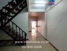 Interior hallway with staircase in a building