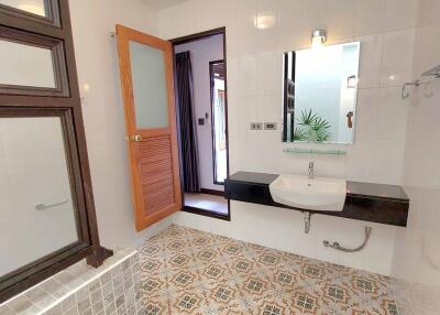 Contemporary bathroom with tiled flooring and modern fixtures