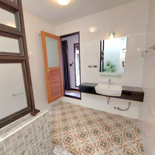 Contemporary bathroom with tiled flooring and modern fixtures