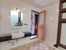 Modern bathroom with sink, mirror, and patterned tiles