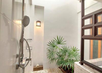 modern bathroom with indoor plants and natural lighting