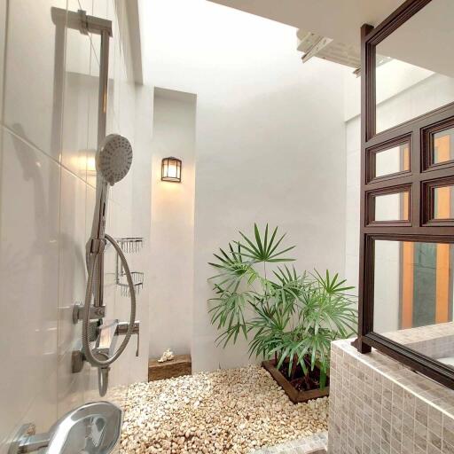 modern bathroom with indoor plants and natural lighting