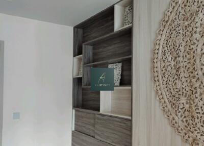 modern bedroom with built-in wooden shelves and decorative wall art