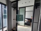 Modern bedroom with large mirror and sliding door wardrobe