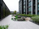 Modern outdoor communal area with seating and greenery