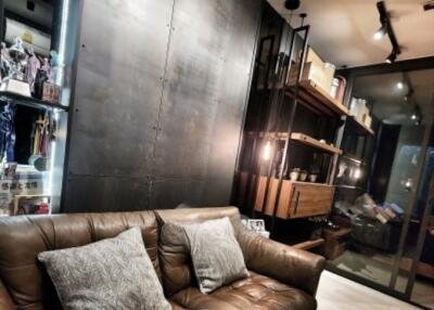 Modern living room with leather sofa and shelving