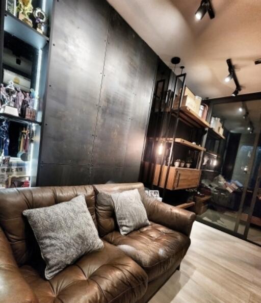 Modern living room with leather sofa and shelving