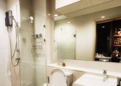 Modern bathroom with glass-enclosed shower and sleek fixtures