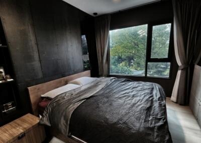 Modern bedroom with large windows and neutral decor