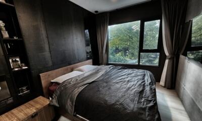 Modern bedroom with large windows and neutral decor