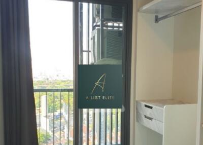 Bedroom with a balcony view and closet space