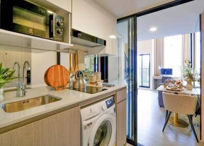 Modern kitchen with amenities and a view of a dining area