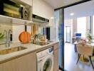 Modern kitchen with amenities and a view of a dining area