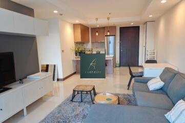 Modern living area with kitchen in the background