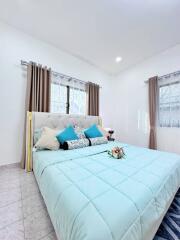 Bright bedroom with a large bed and decorative pillows