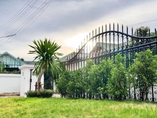 Gated front yard with greenery