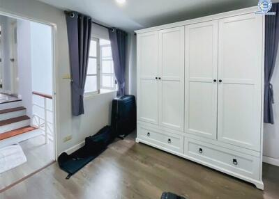 Bedroom with wardrobe and staircase