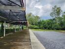 empty outdoor space with parking area and trees