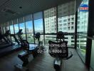 Fitness center with exercise equipment and large windows