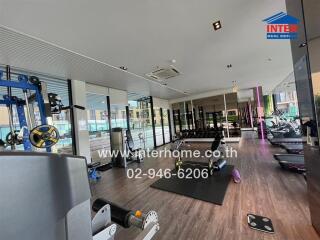 Modern fitness center with various workout equipment