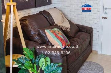 Cozy living room with brown leather sofa