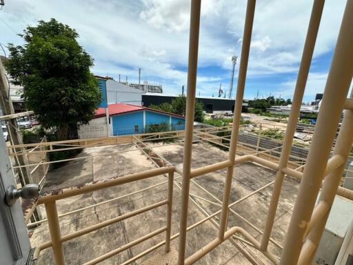 View of the outdoor area with surrounding buildings and trees