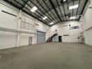 Spacious industrial warehouse with high ceilings and mezzanine