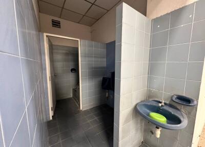 Bathroom with two stalls and sink