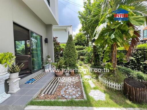 Beautifully landscaped garden with various plants and seating area