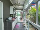 Bright kitchen with large windows and modern appliances