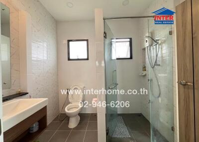 Modern bathroom with shower area and toilet