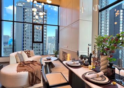 Modern living room with large windows and city view