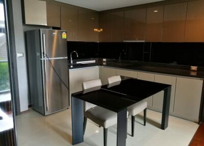 Modern kitchen with dining table