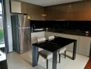 Modern kitchen with dining table