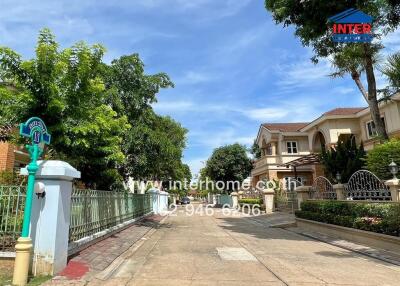 Entrance to a residential building with a gated fence