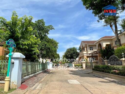 Entrance to a residential building with a gated fence