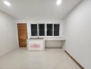 Minimalist kitchen with wooden door and large windows