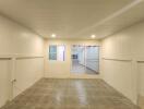 Empty room with tiled floor and wooden ceiling