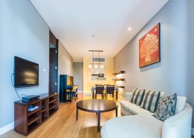 Spacious modern living room with a view of the dining area