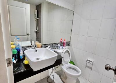 Modern bathroom with white tiles and sink