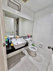 Modern bathroom with white tiles and sink