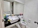 Modern bathroom with white tiles and sink