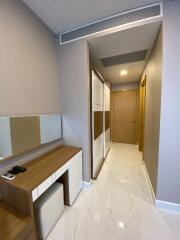 Modern bedroom hallway with vanity desk and wardrobe