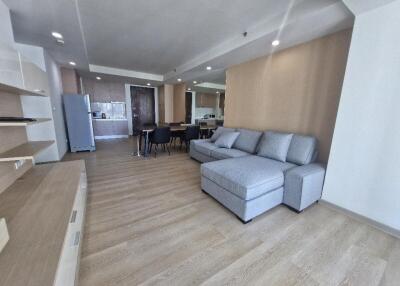 Spacious living area with couch and dining table